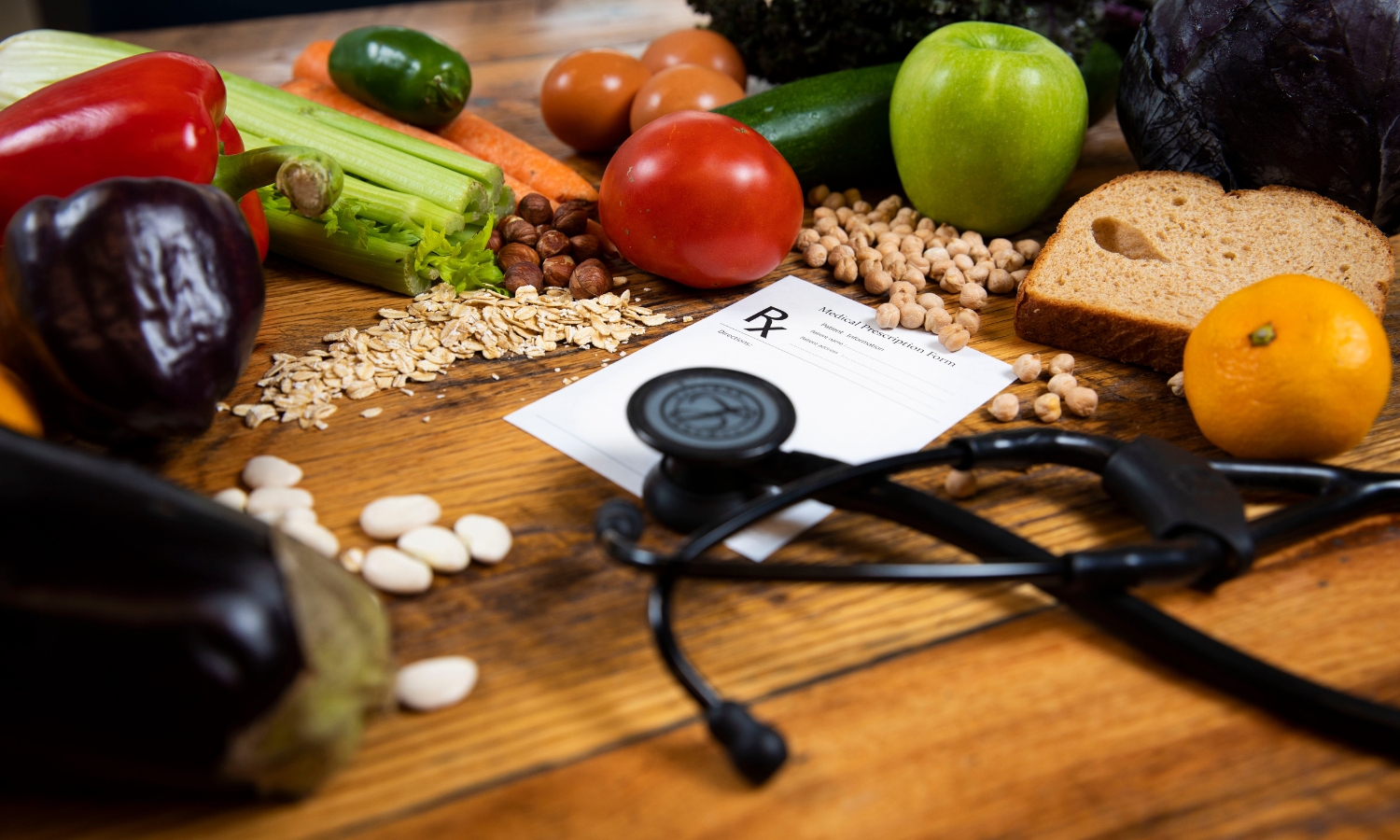 Table displaying fruits and vegetables with prescription pad