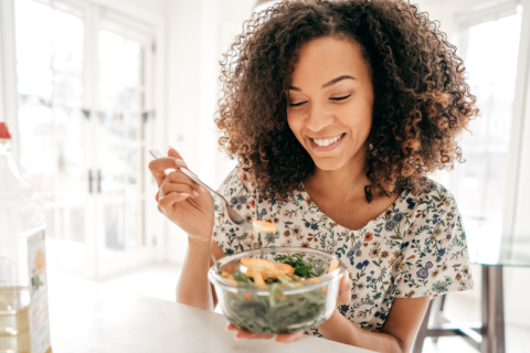 A person eats a salad