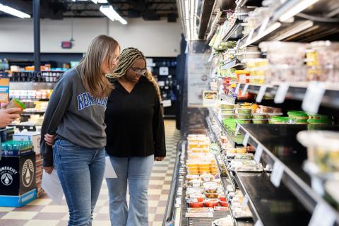 People shop at a grocery store