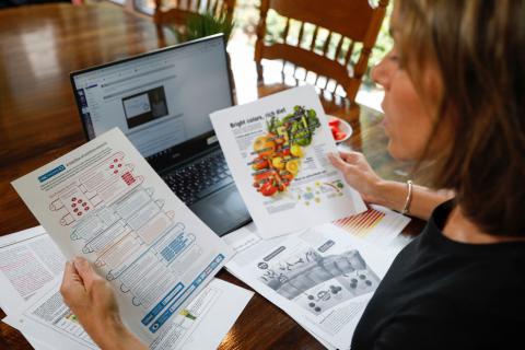 A person reviews nutrition notes